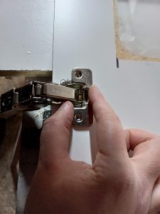 Cabinet hinge installed using 3d printed drilling templates